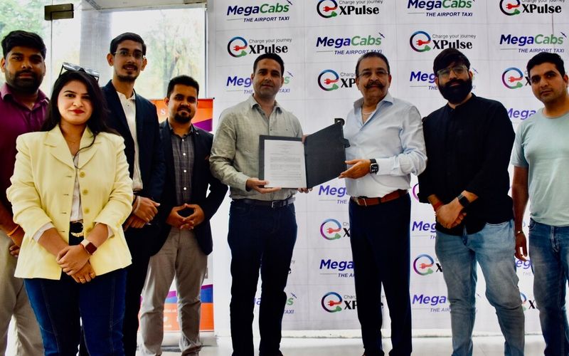 MegaCabs and XPulse teams at the signing